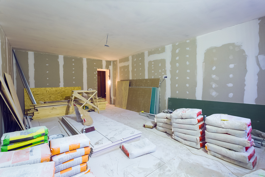 Materials for constraction (putty packs, sheets of plasterboard or drywall) in apartment is under construction, remodeling, renovation, extension, restoration and reconstruction.